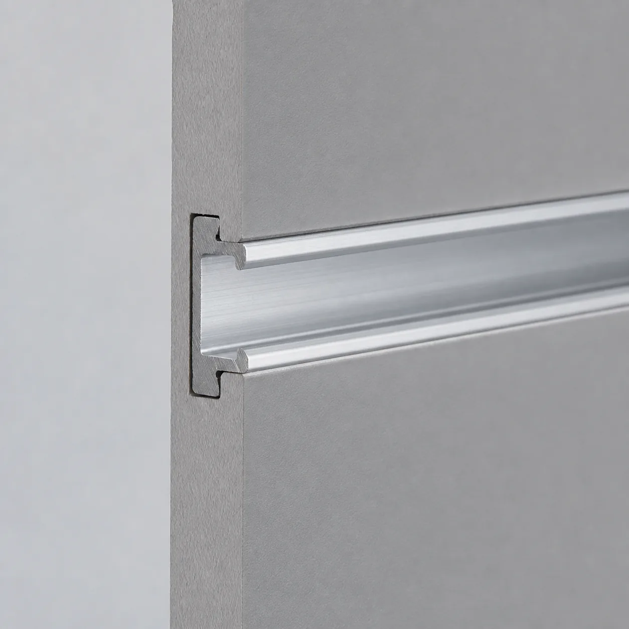 Illustration showing an aluminum insert fitted into a slatwall groove