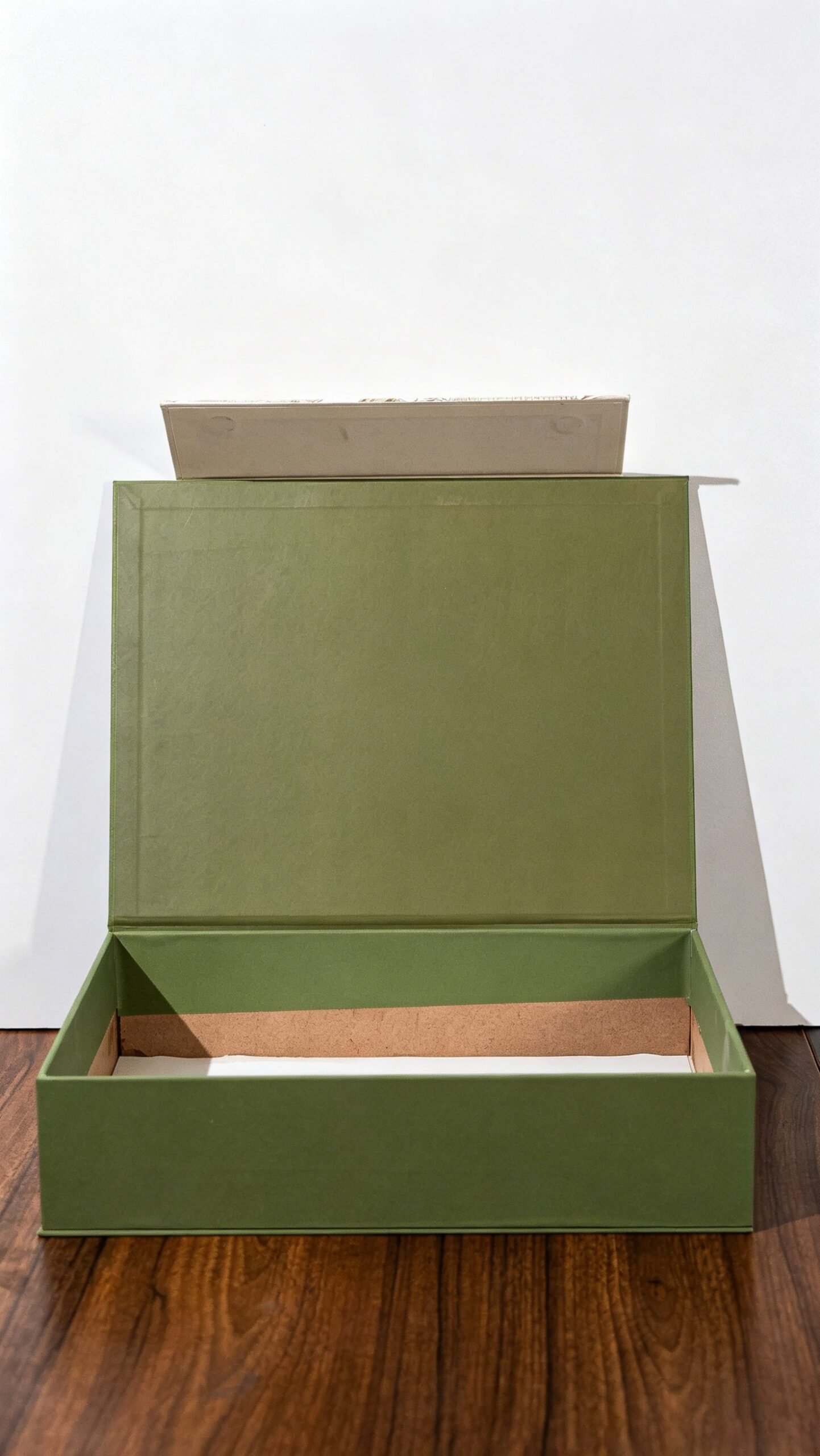 Unfinished interior of a green wrapped MDF box sample